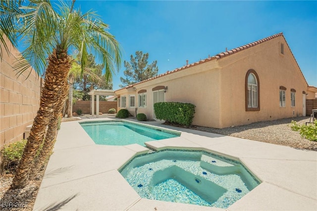 3882 Genoa Dr, Las Vegas, NV 89141 - view of swimming pool featuring a fenced backyard, a patio area, and a pool with connected hot tub