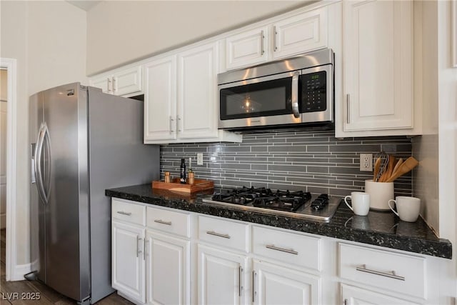 3882 Genoa Dr, Las Vegas, NV 89141 - kitchen with appliances with stainless steel finishes, white cabinets, and tasteful backsplash