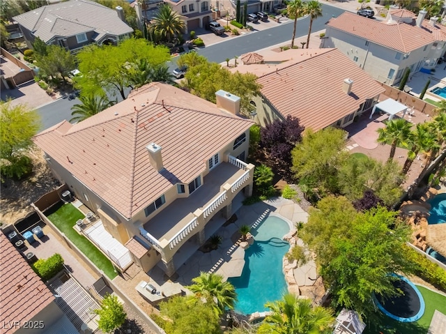aerial view of residential area with a pool area