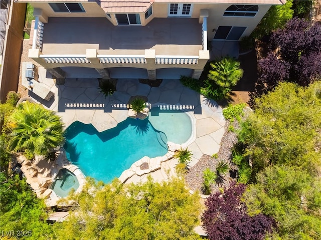 view from above of property with a pool area