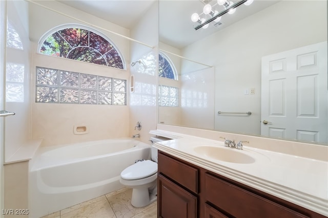 bathroom with healthy amount of natural light, toilet, vanity, and marble look tile flooring