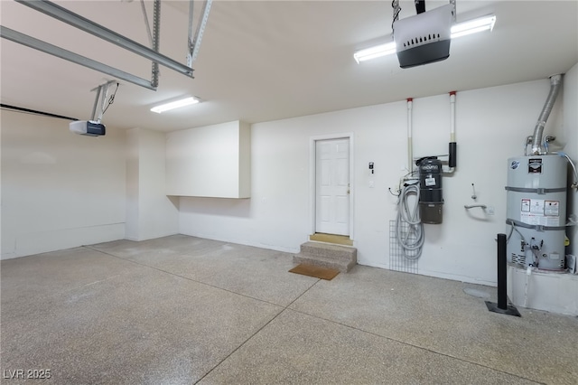 garage with water heater, a garage door opener, and a central vacuum unit