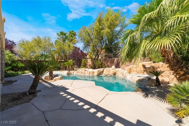 view of pool featuring a fenced backyard and a patio