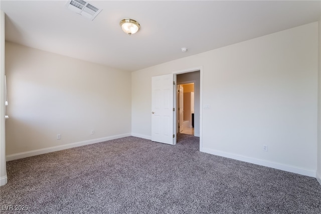 empty room with carpet flooring, baseboards, and a smoke detector