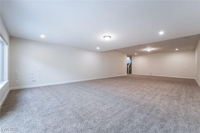 carpeted spare room with stairs, recessed lighting, and baseboards