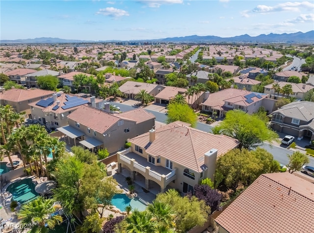 aerial view of residential area featuring a mountain backdrop