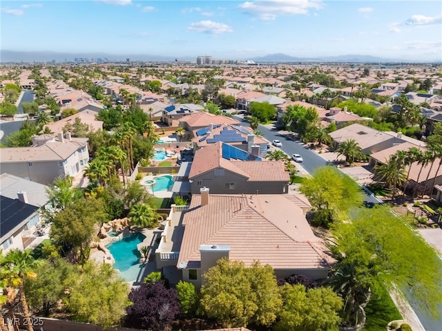 aerial perspective of suburban area featuring a pool
