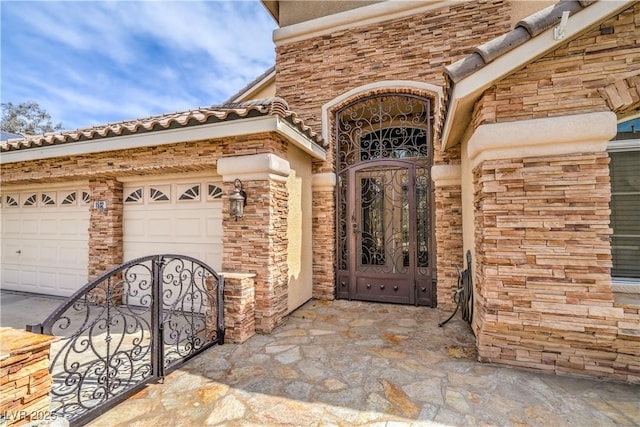 1532 Via Cassia, Henderson, NV 89052 - entrance to property with a garage and stone siding