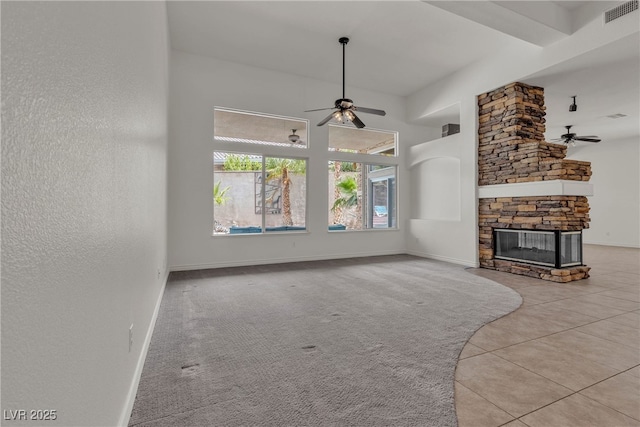 1532 Via Cassia, Henderson, NV 89052 - unfurnished living room with a ceiling fan, a stone fireplace, baseboards, and tile patterned flooring