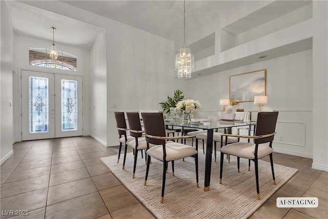 1532 Via Cassia, Henderson, NV 89052 - tiled dining space featuring a high ceiling, a chandelier, french doors, and baseboards