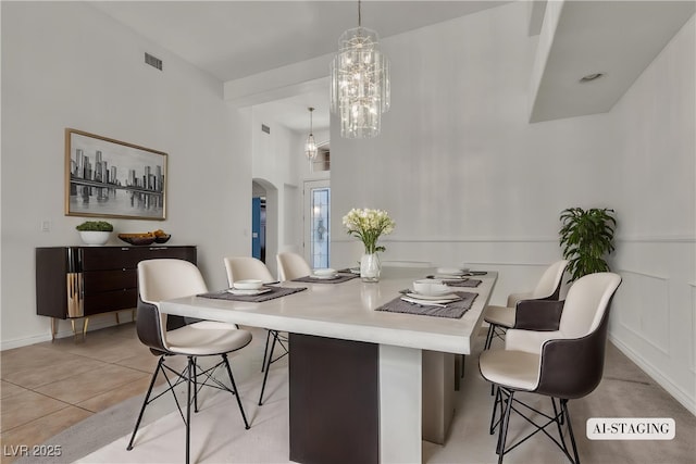 1532 Via Cassia, Henderson, NV 89052 - dining room with arched walkways, a chandelier, and light tile patterned floors