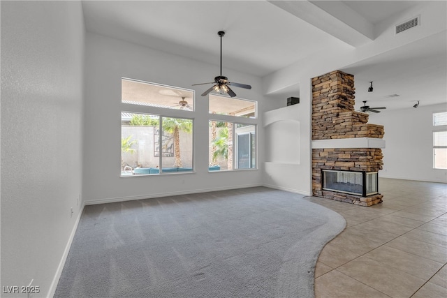 1532 Via Cassia, Henderson, NV 89052 - unfurnished living room featuring ceiling fan, a fireplace, tile patterned flooring, and a high ceiling