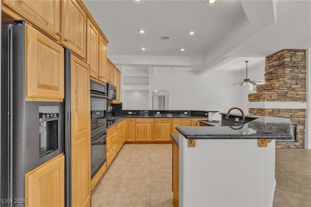 1532 Via Cassia, Henderson, NV 89052 - kitchen featuring paneled built in refrigerator, a breakfast bar, ceiling fan, light tile patterned floors, and recessed lighting
