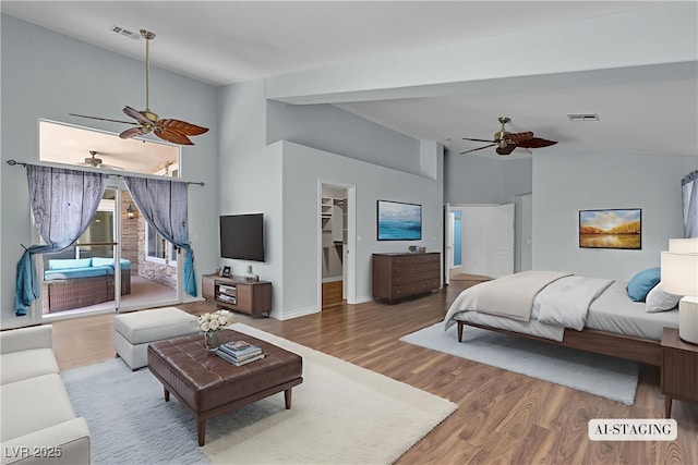 1532 Via Cassia, Henderson, NV 89052 - bedroom with a spacious closet, wood finished floors, high vaulted ceiling, access to outside, and a ceiling fan