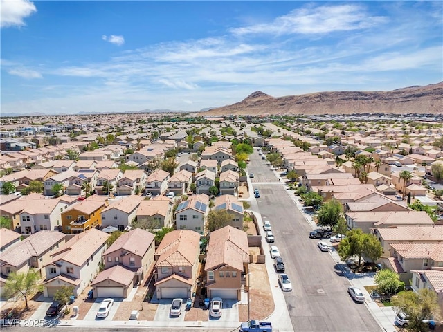 aerial perspective of suburban area featuring a mountain backdrop