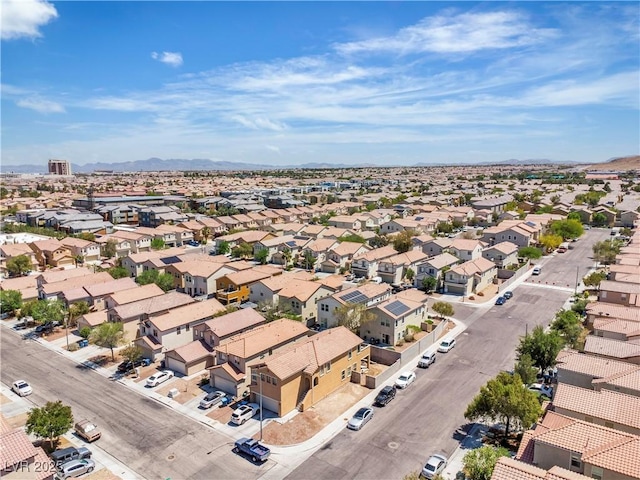 aerial view of residential area featuring mountains