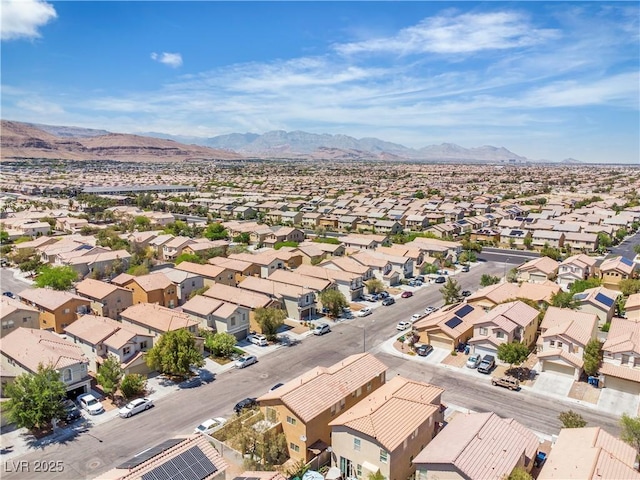 aerial perspective of suburban area featuring a mountain backdrop