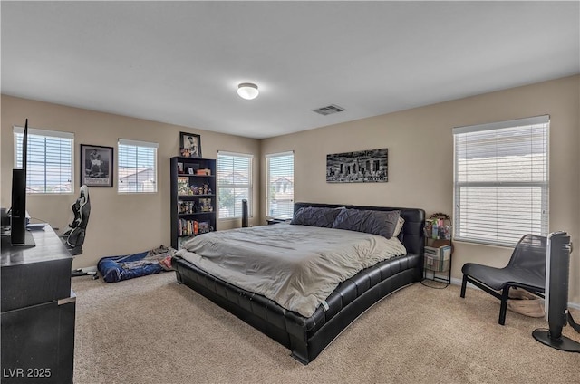 bedroom with carpet and baseboards