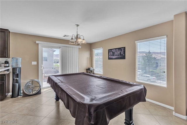 recreation room with light tile patterned floors, a chandelier, billiards table, and baseboards