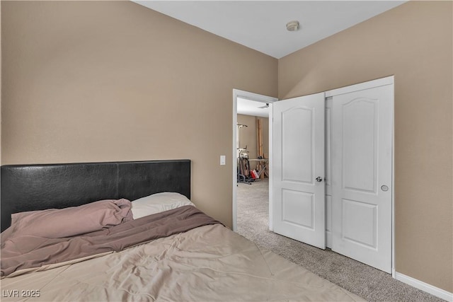 carpeted bedroom featuring baseboards
