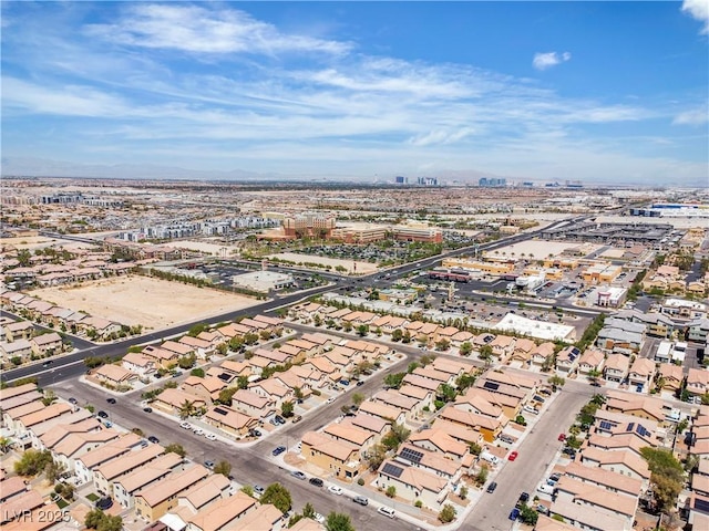 aerial view of property and surrounding area with nearby suburban area