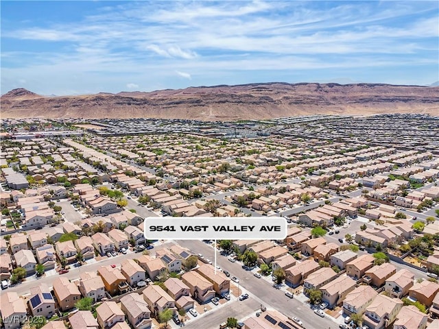 aerial view of residential area featuring a mountain backdrop