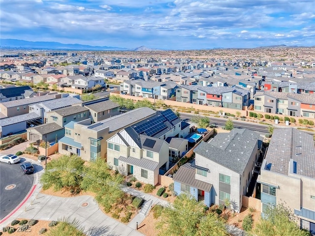 aerial perspective of suburban area with a mountainous background