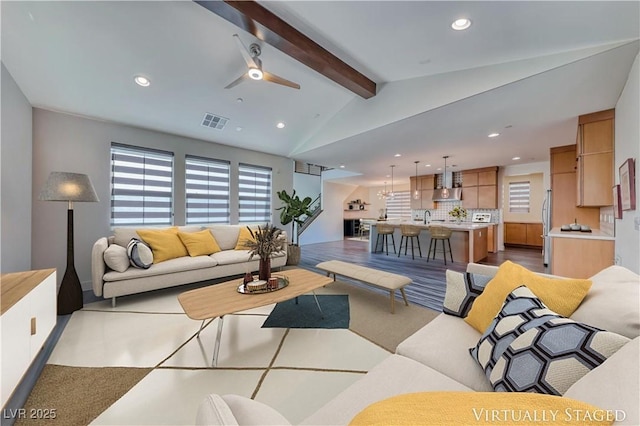 living area with recessed lighting and a ceiling fan