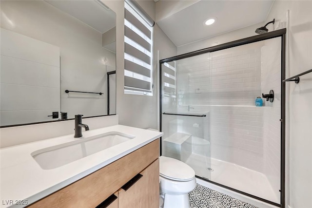 full bath featuring a shower stall, toilet, vanity, recessed lighting, and tile patterned floors