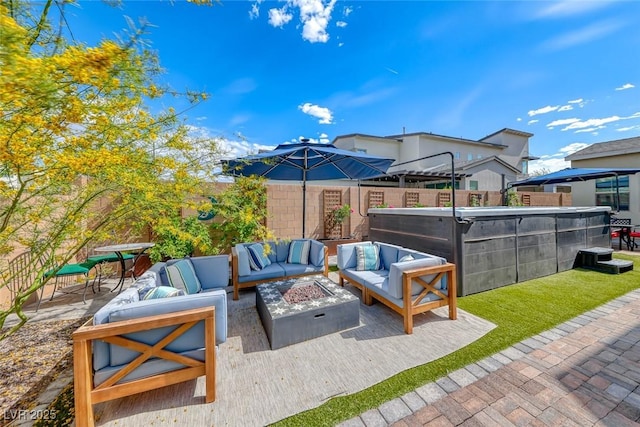 view of patio with an outdoor living space with a fire pit