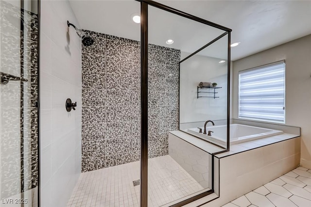 bathroom with tile patterned flooring, a shower stall, a bath, and recessed lighting