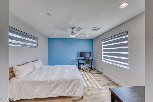 bedroom with wood finished floors, a ceiling fan, a desk, recessed lighting, and baseboards