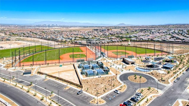 aerial view of residential area featuring mountains