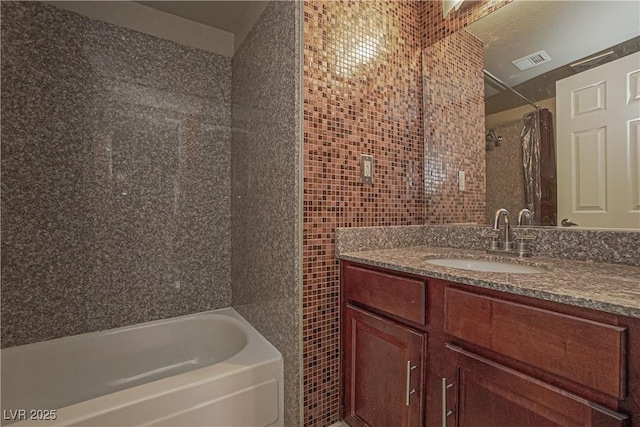 full bathroom featuring tile walls, curtained shower, a tub, and vanity