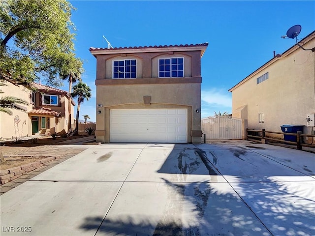 983 Plantain Lily Ave, Las Vegas, NV 89183 - view of front facade with stucco siding, driveway, a tile roof, and an attached garage