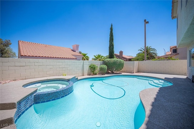 1620 Western Lily St, Las Vegas, NV 89128 - view of pool featuring a pool with connected hot tub and a fenced backyard