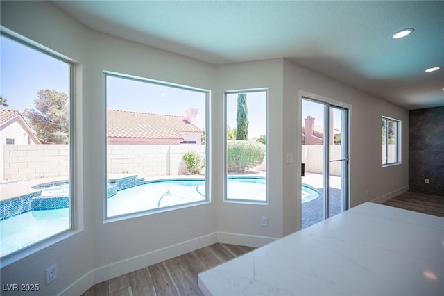 1620 Western Lily St, Las Vegas, NV 89128 - unfurnished dining area with wood finished floors, baseboards, and recessed lighting