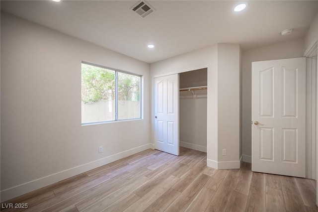 1620 Western Lily St, Las Vegas, NV 89128 - unfurnished bedroom with light wood-type flooring, baseboards, recessed lighting, and a closet