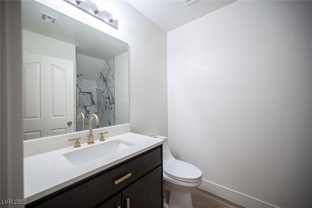 1620 Western Lily St, Las Vegas, NV 89128 - bathroom featuring toilet, wood finished floors, a shower, vanity, and a textured wall