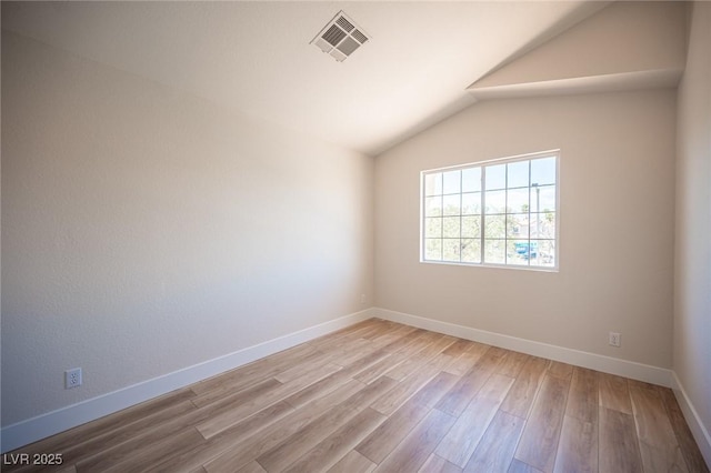 1620 Western Lily St, Las Vegas, NV 89128 - spare room featuring wood finished floors, lofted ceiling, and baseboards