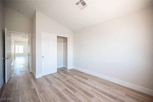 1620 Western Lily St, Las Vegas, NV 89128 - unfurnished bedroom featuring lofted ceiling, light wood-style floors, baseboards, and a closet