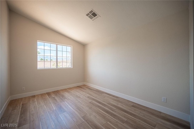 1620 Western Lily St, Las Vegas, NV 89128 - empty room with wood finished floors, lofted ceiling, and baseboards