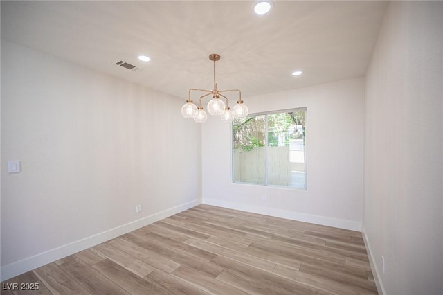 1620 Western Lily St, Las Vegas, NV 89128 - spare room featuring recessed lighting, light wood finished floors, a chandelier, and baseboards