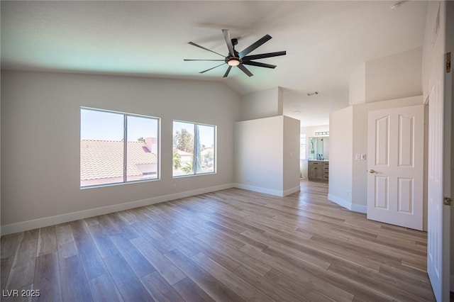 1620 Western Lily St, Las Vegas, NV 89128 - empty room with healthy amount of natural light, a ceiling fan, wood finished floors, and lofted ceiling
