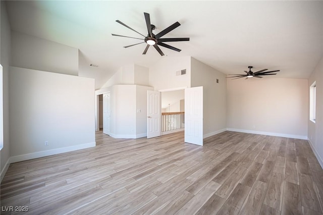 1620 Western Lily St, Las Vegas, NV 89128 - unfurnished living room with a ceiling fan, light wood finished floors, baseboards, and high vaulted ceiling