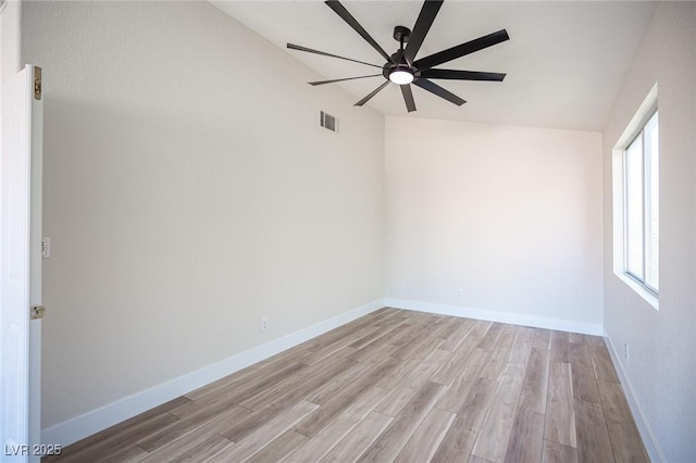 1620 Western Lily St, Las Vegas, NV 89128 - spare room with ceiling fan, lofted ceiling, light wood-style flooring, and baseboards