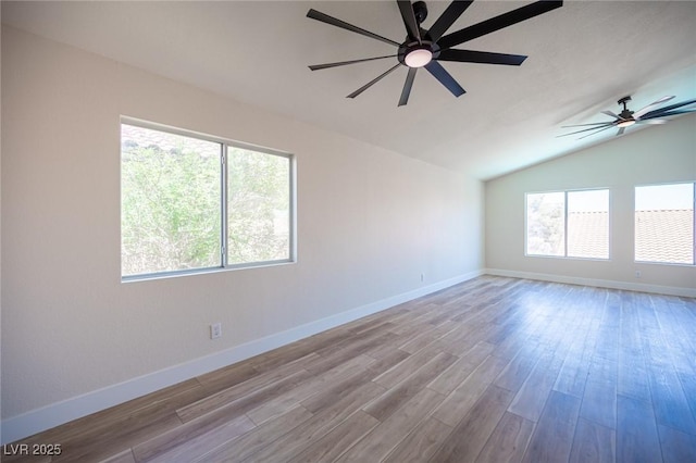 1620 Western Lily St, Las Vegas, NV 89128 - spare room with lofted ceiling, a ceiling fan, wood finished floors, and baseboards