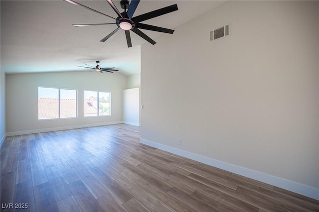 1620 Western Lily St, Las Vegas, NV 89128 - empty room with lofted ceiling, a ceiling fan, wood finished floors, and baseboards
