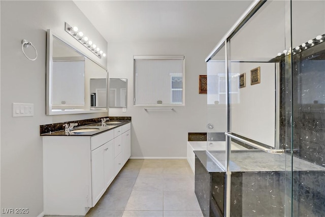 748 Dellenbaugh Ct, Las Vegas, NV 89178 - full bathroom featuring double vanity, tile patterned floors, baseboards, a bath, and a stall shower