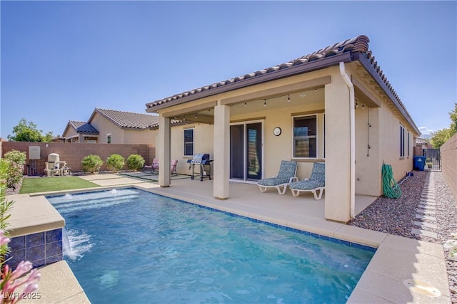 748 Dellenbaugh Ct, Las Vegas, NV 89178 - rear view of house with a patio, stucco siding, a fenced backyard, and a tiled roof